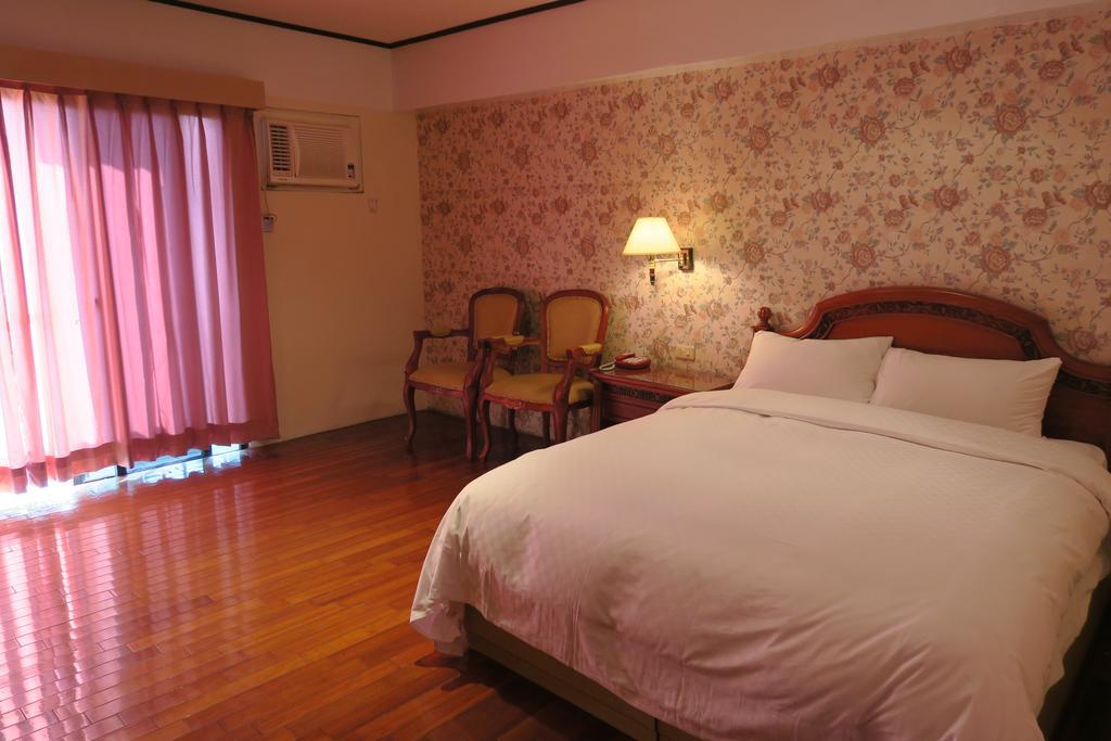 Champagne Hotel Jiaoxi Værelse billede